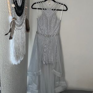 Sleeveless short in the front and long in the back sheer fabric with shorts
